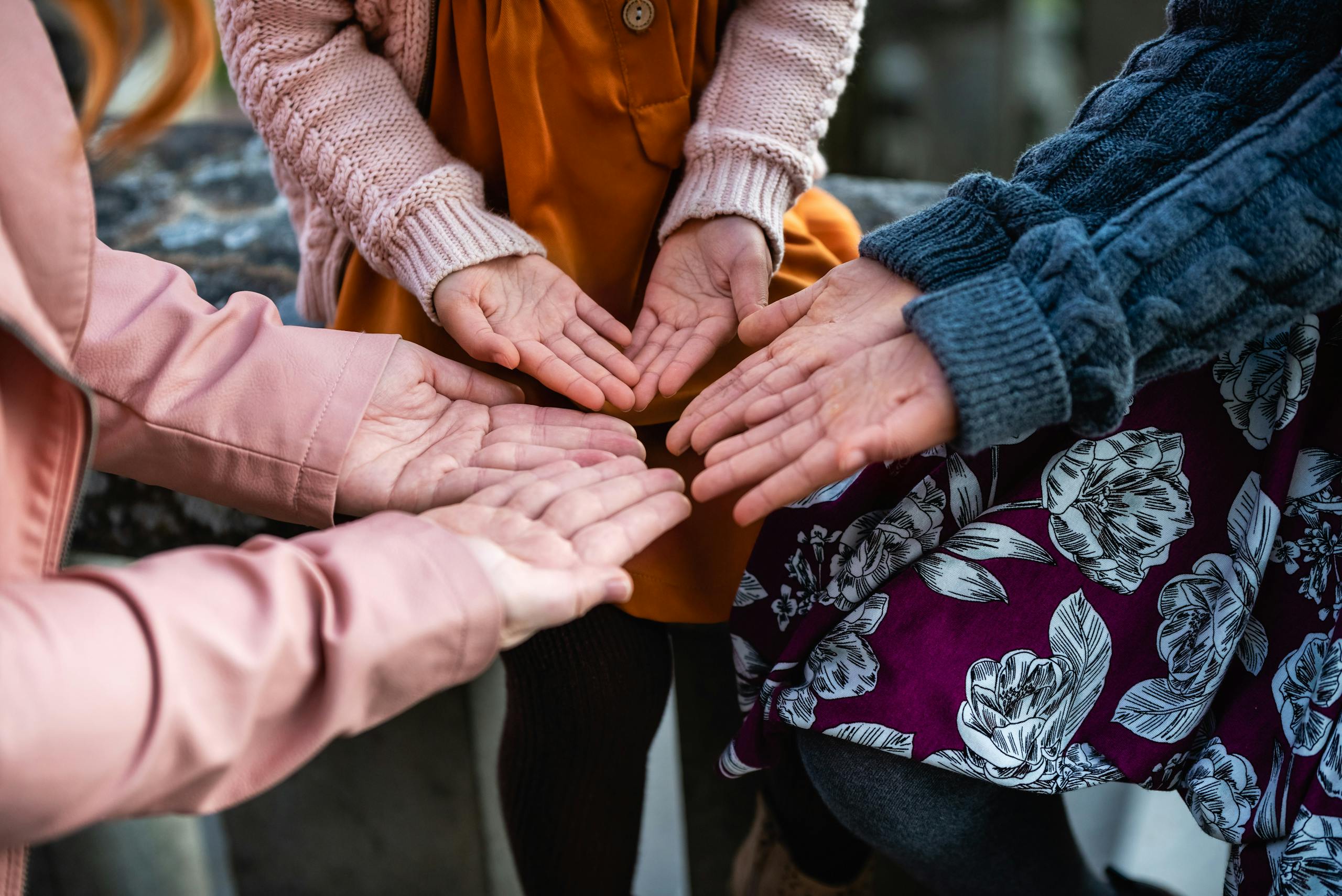 Hands of Women Standing Together in Circle